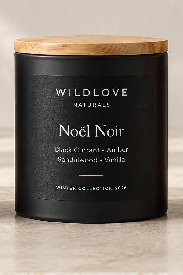 Noël Noir candle — matte black straight-sided metal tin with a natural wood lid and a refined Winter Collection 2026 label