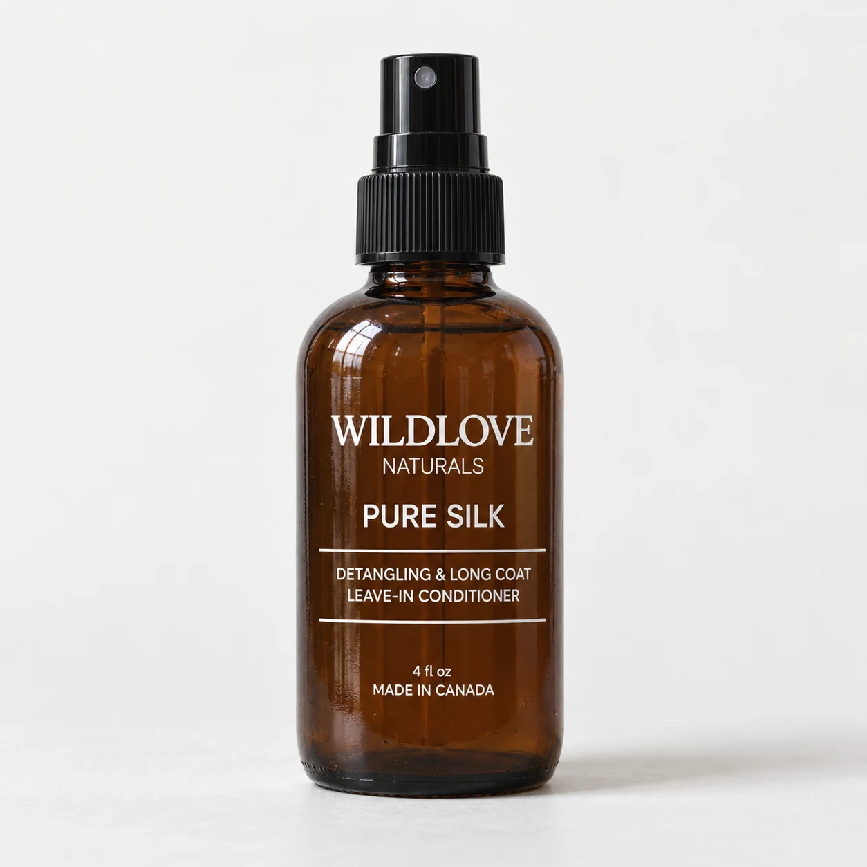 Wildlove Naturals Pure Silk leave-in coat conditioner in a 4 fl oz amber glass spray bottle