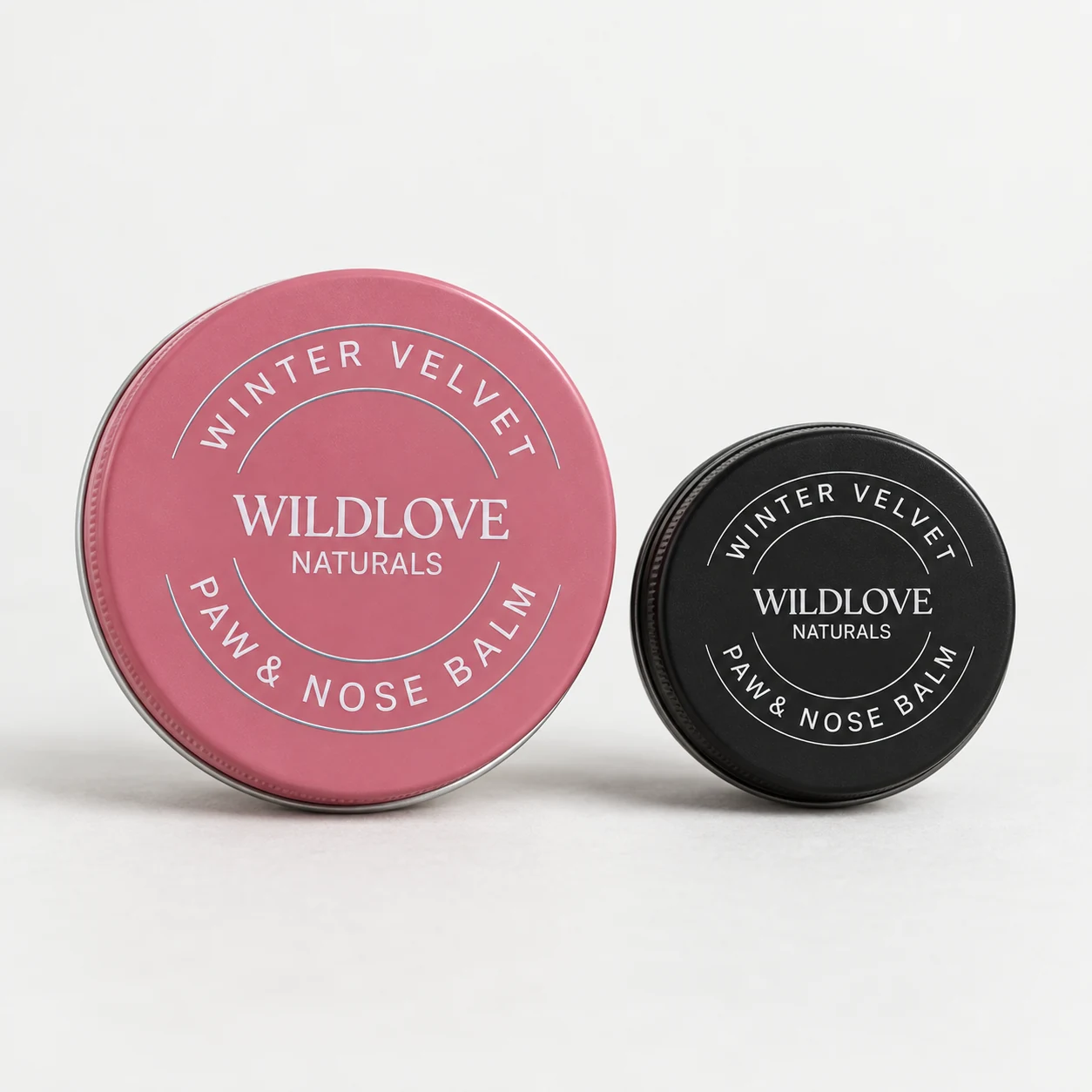 Wildlove Winter Velvet paw and nose balm in a 2 oz pink tin and a smaller 1 oz black tin